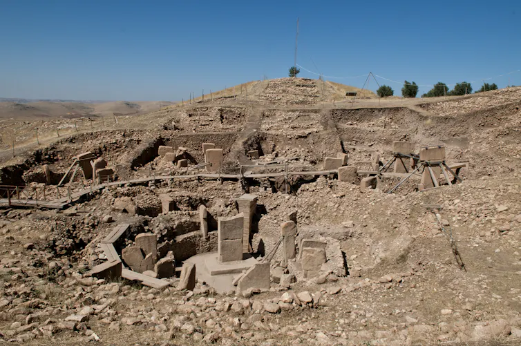 Circular ruined structure in the desert.