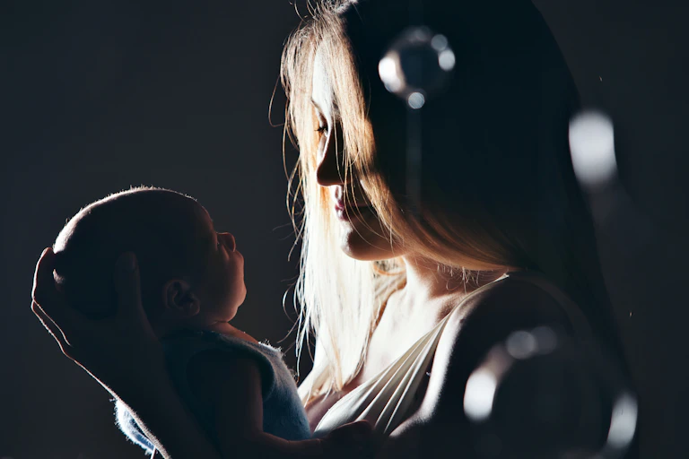 A woman holds a baby