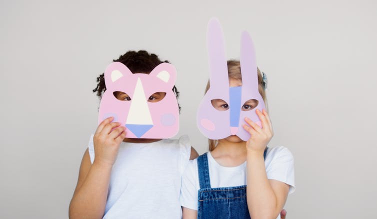 two kids with animal masks