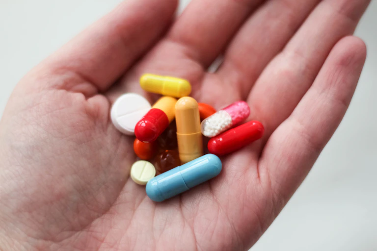 Hand holding pills
