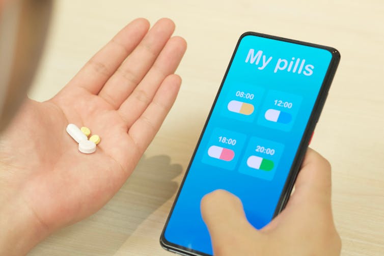 Phone with pill reminders on screen