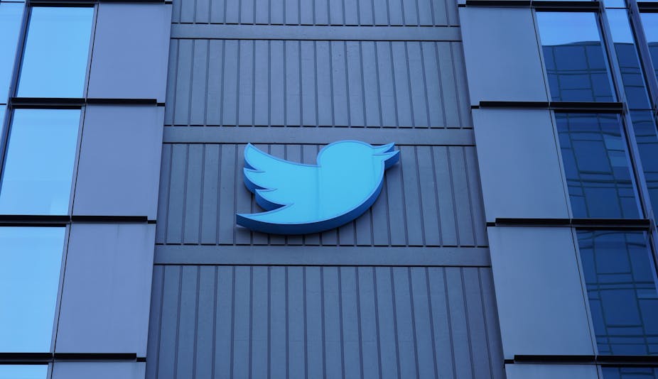 The Twitter logo, a blue bird, adorns the outside of their glass San Francisco building