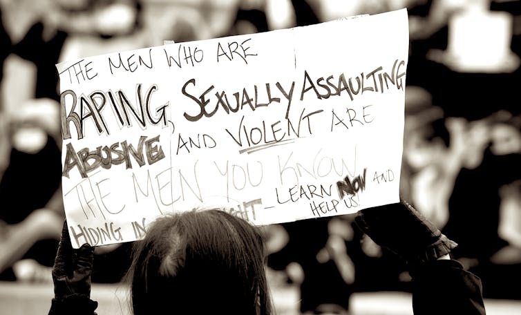 Protester hplding up a sign