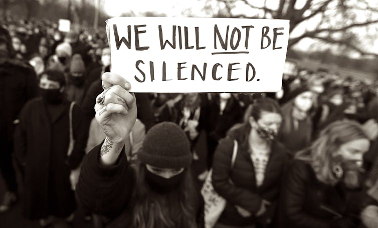 Protesters holding a banner