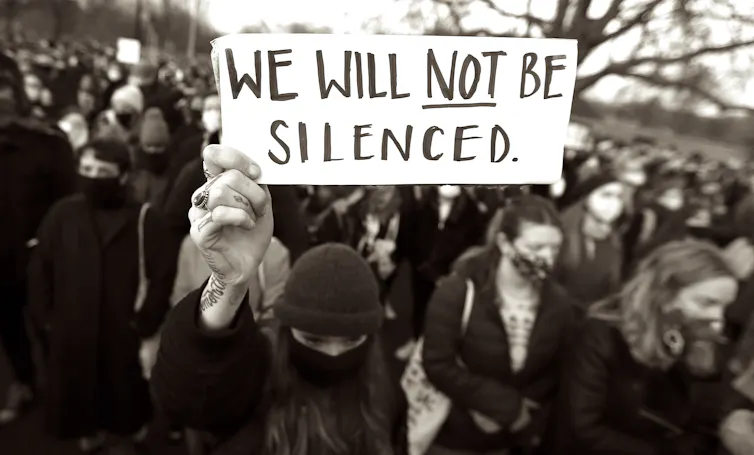 Protesters holding a banner