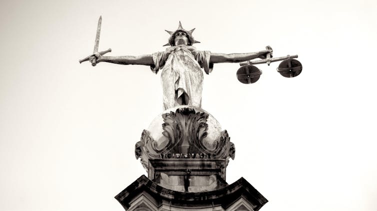 Statue of woman holding the scales of justice