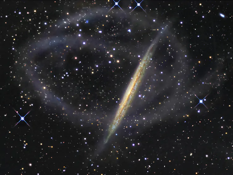 Image of NGC 5907, a galaxy which hosts faint streams of stars that wrap all around it.