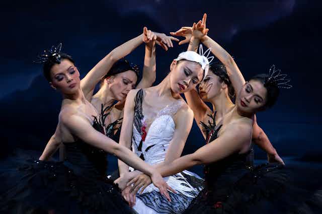 Five ballet dancers: swans in black and white