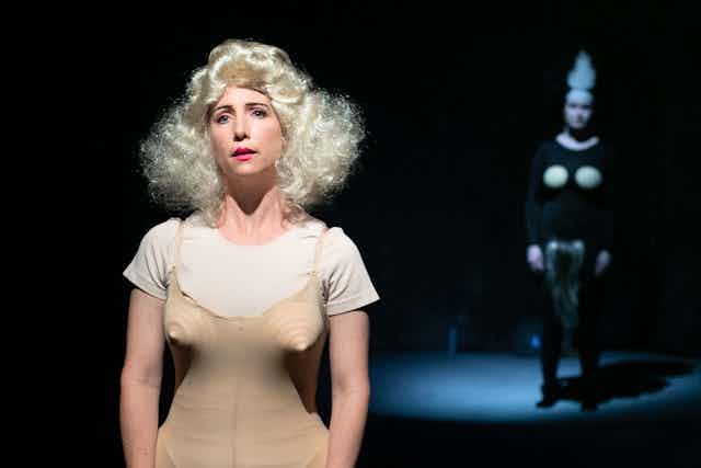 A woman in flesh-coloured clothes