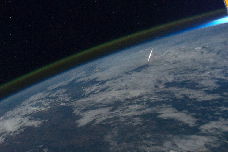 A photo taken from space shows a meteorite burning up in Earth's atmosphere.