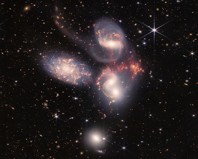 Image of galaxies dancing in space.