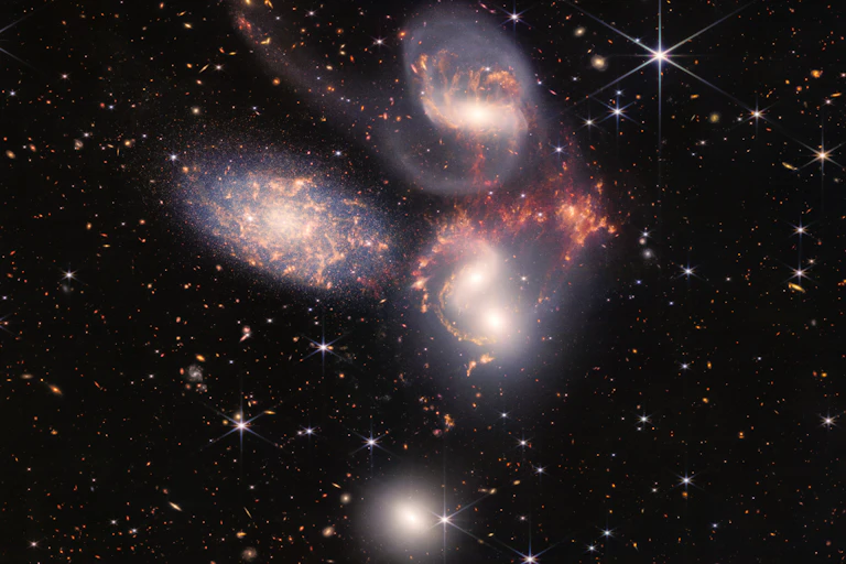 Image of galaxies dancing in space.