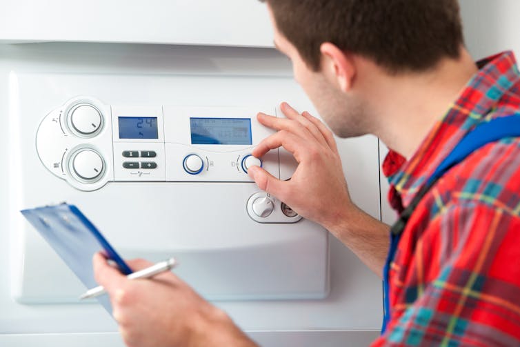 A technician servicing his boiler.