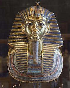 Tutankhamun's golden death mask, with blue detailing around the headdress.