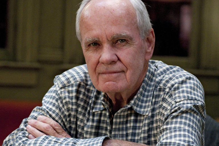 A man in a plaid shirt.