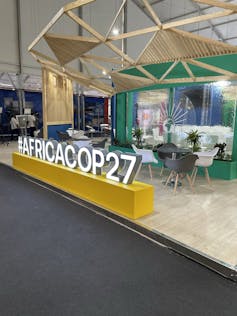 Conference area with 'AfricaCOP27' sign