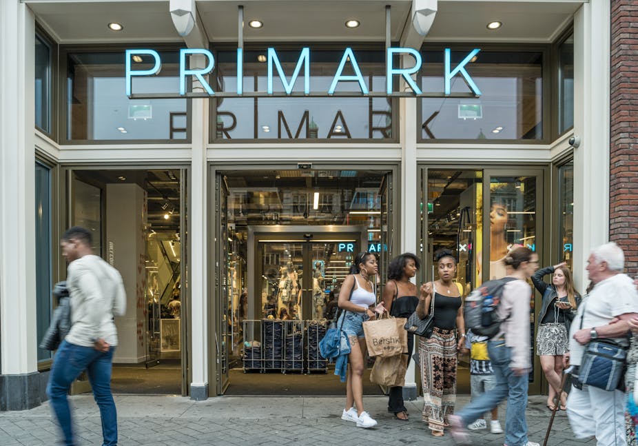 Motion blur people walking shopping at the Primark shopping mall Amsterdam Primark Damrak June 2017.
