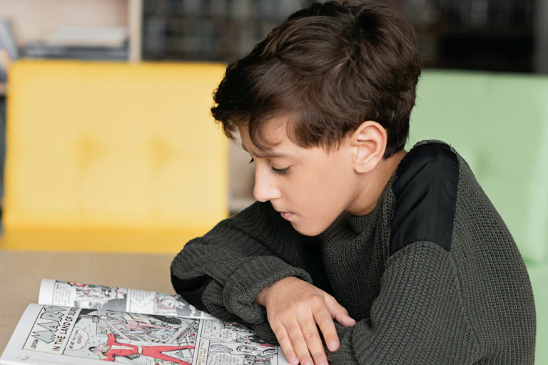 A child reads a comic.