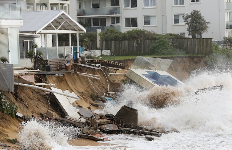 damaged coastline including pool fallen onto beach