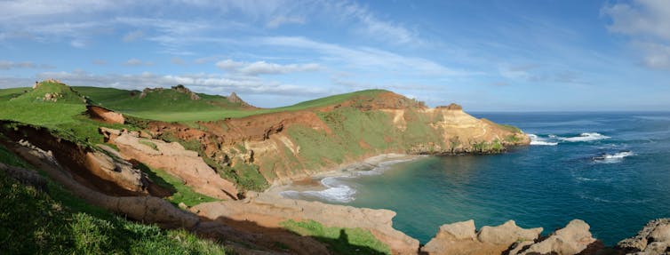 A landscape image of Rēkohu/Chatham Islands, across a wide bay.