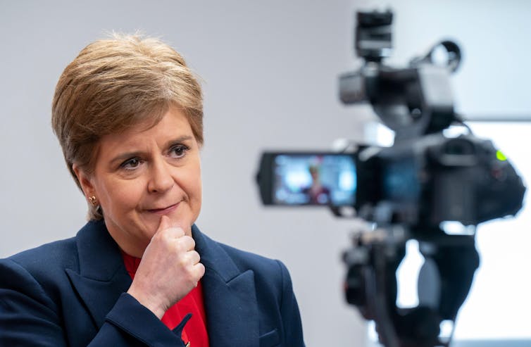 Nicola Sturgeon being interviewed with a camera in the foreground.