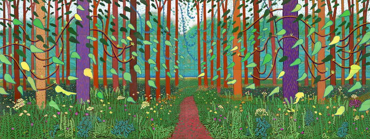 Painting of trees in a wood in bright colours.