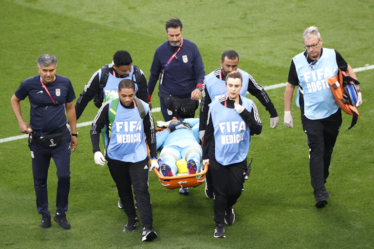Goalkeeper Ali Beiranvand of Iran is carried on a stretcher.