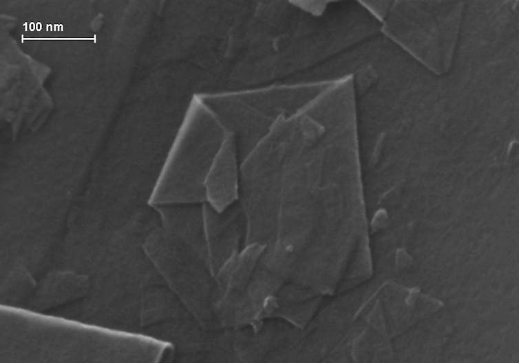 A thin, folded, rough-edged piece of graphene.