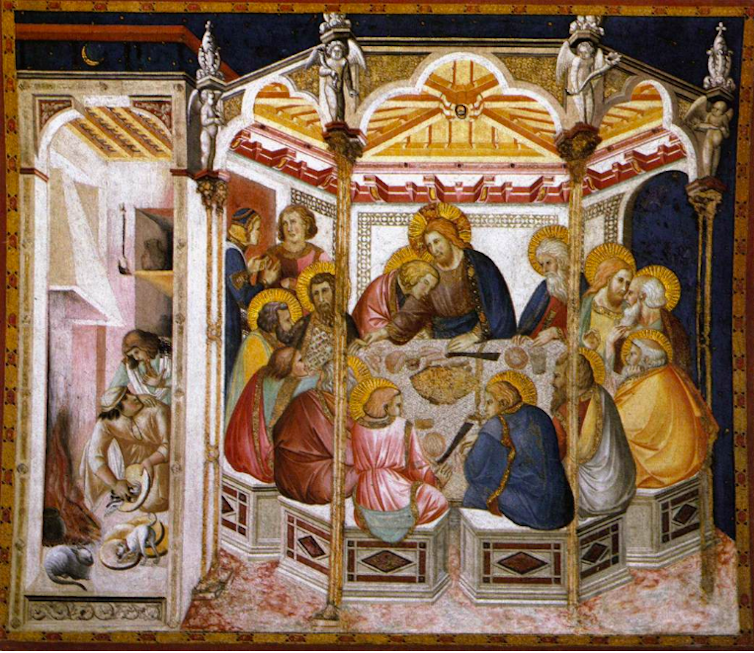 A painting of Jesus and his disciples, gathered round a table on the right. On the left, in a corridor outside of the dinner, a cat and dog are shown.