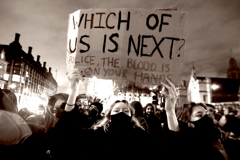 Protesters hold banners during a protest