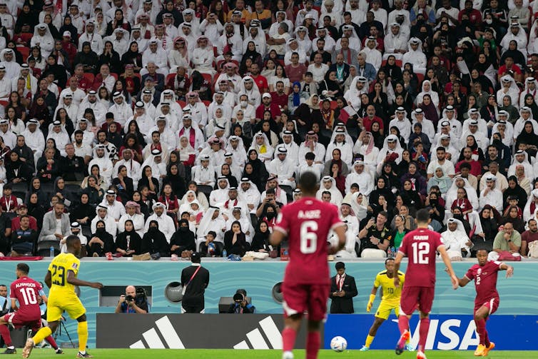 Fans in a football stadium.