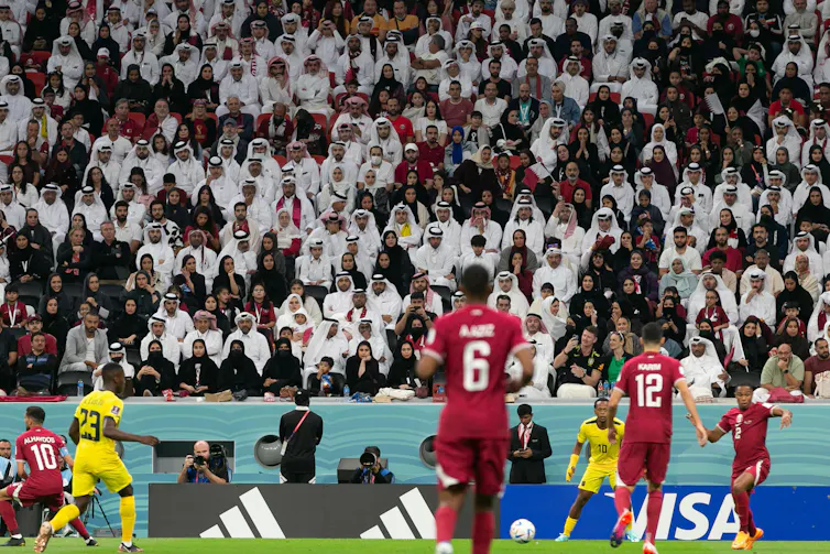 Fans in a football stadium.