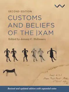 A book titled Customs and Beliefs of the IXam with a brown cover featuring depictions of rock art figures.