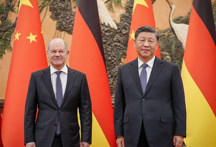 Scholz and Xi Jingping pose for photographs at their meeting in China earlier this month.