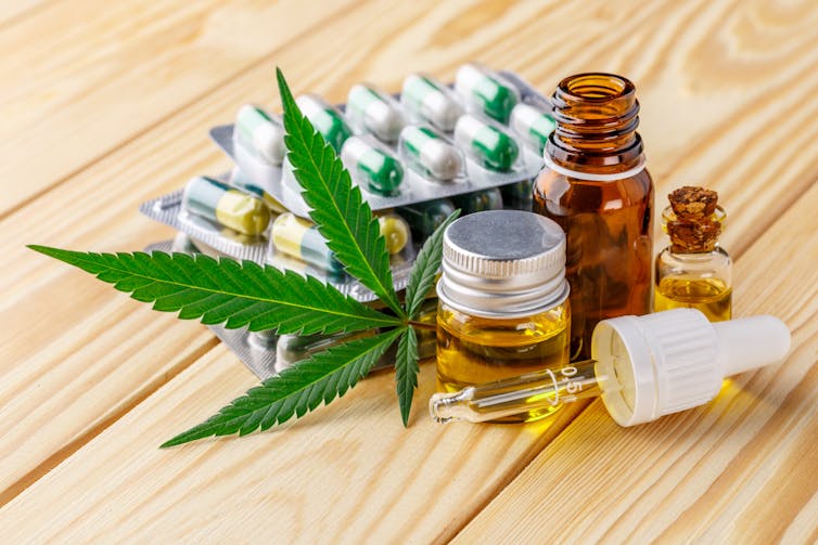 An assortment of cannabis products, including pills and oils. Our review included studies which looked at a variety of different cannabis products. Bukhta Yurii/ Shutterstock