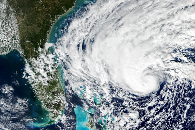 Satellite image of a hurricane curling toward Florida from the Atlantic Ocean.