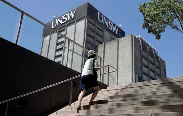 A women climbing stairs at UNSW.