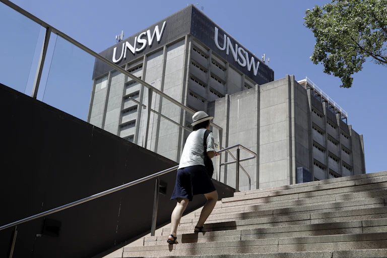 A women climbing stairs at UNSW.