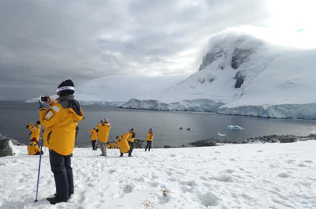 tourists on Antarctic peninsula