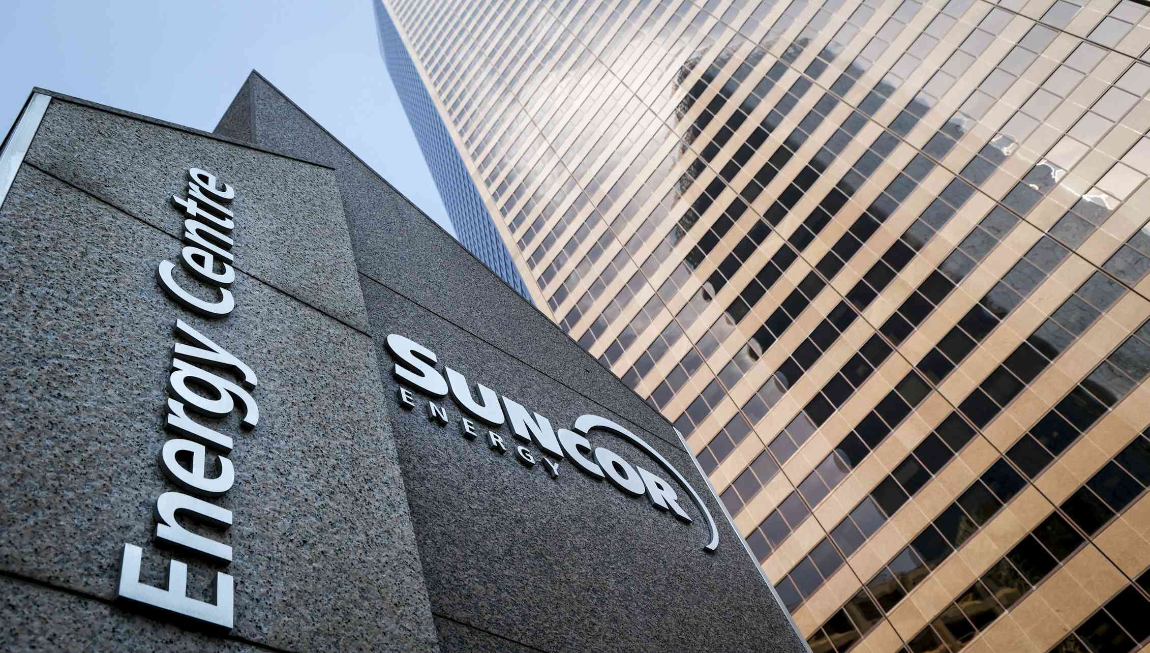 A high angle shot of a building that says Suncor Energy Centre on it