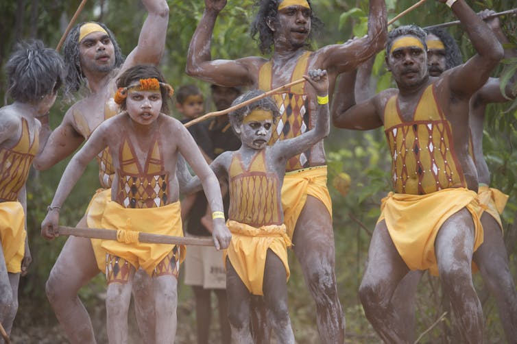 Indigenous people perform ceremonial dance