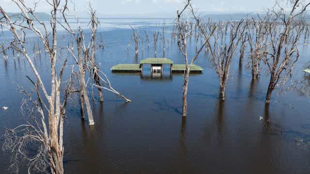 A building marooned in a flooded lake basin