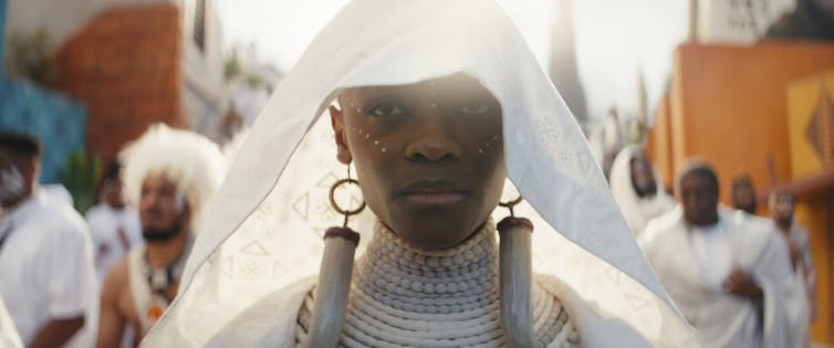 A woman in traditional Orisha funeral dress.