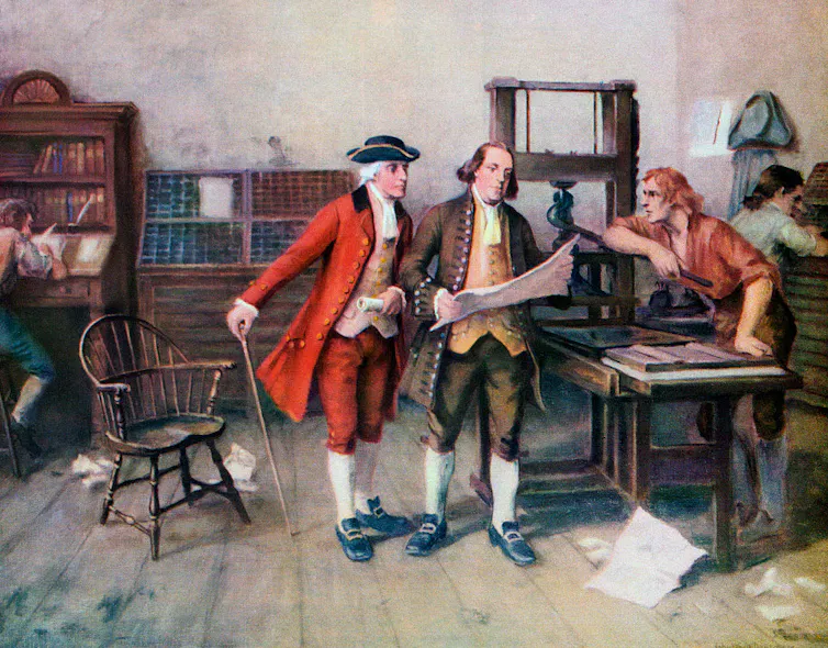 Three men in colonial dress, one holding a newspaper.