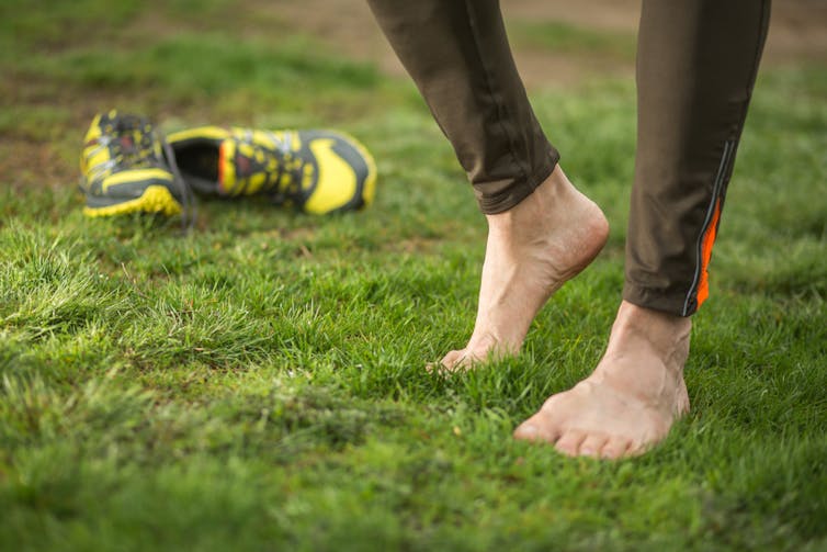 A person stretches their foot.