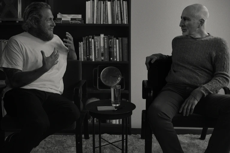 two men talking, black and white photo