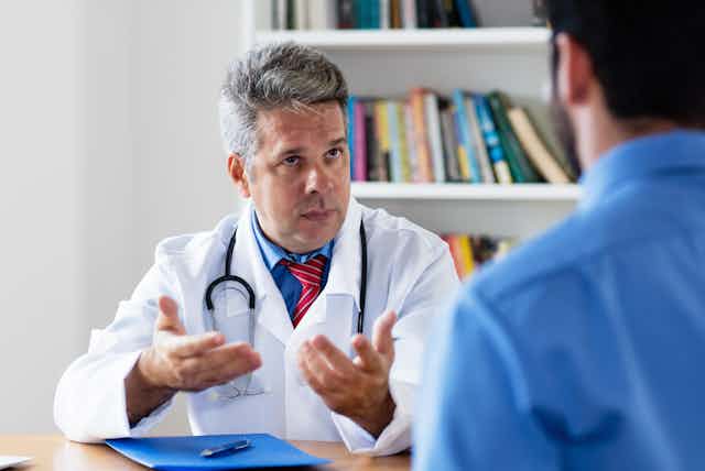 Doctor explaining something to a patient