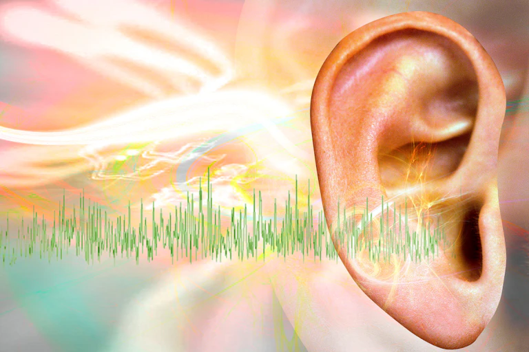 Against an impressionistic background of white, pink and yellow streaks suggesting pain and irritation, an artist's illustration depicts an ear with tinnitus.