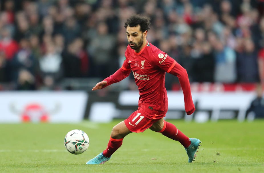 Mohammed Salah playing football for Liverpool. 