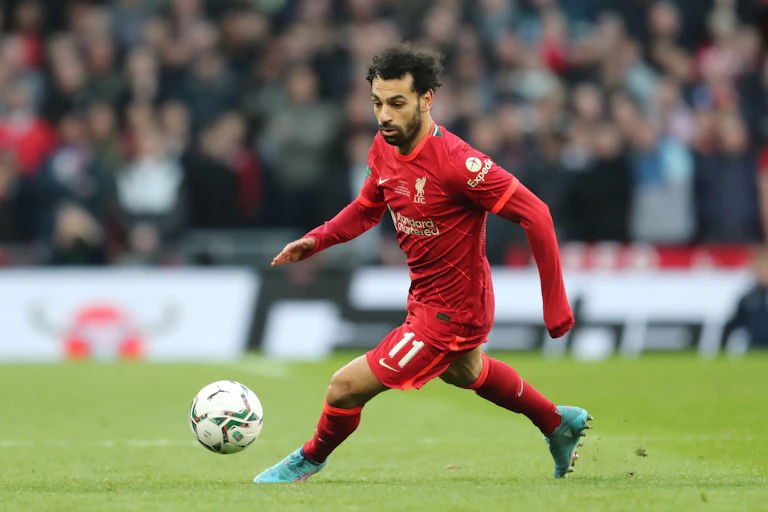 Mohammed Salah playing football for Liverpool.
